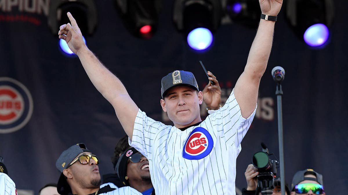 Chicago Cubs first baseman Anthony Rizzo celebrating at a World Series victory rally in Chicago