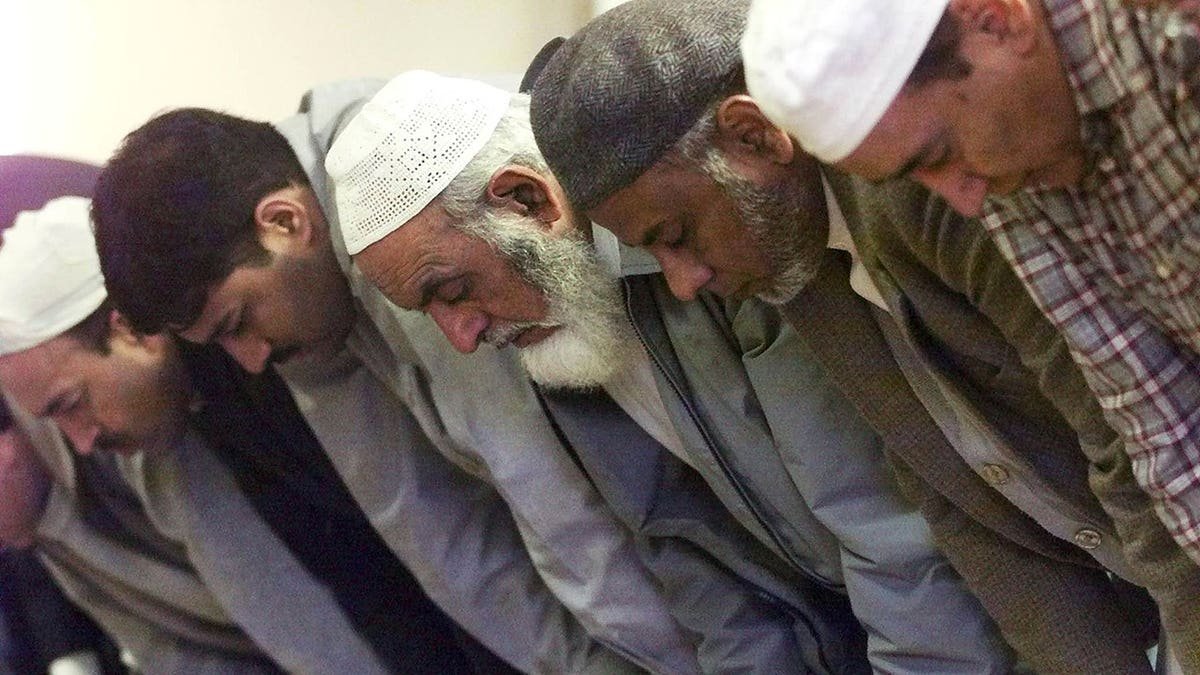 A member of the Islamic community praying inside Anwar-E-Madina Mosque in Edinburgh