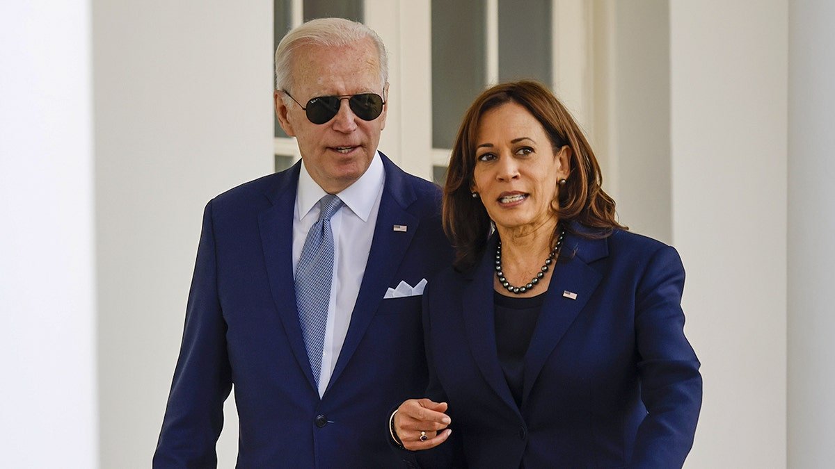 Former Vice President Kamala Harris walking and talking with President Joe Biden through the White House Colonnade