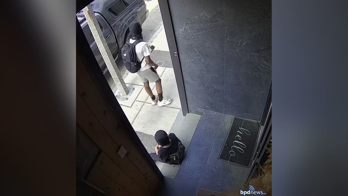 Suspects waiting near a doorway