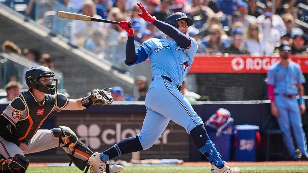 Toronto Blue Jays' Brandon Valenzuela hitting a home run during a baseball game in Toronto