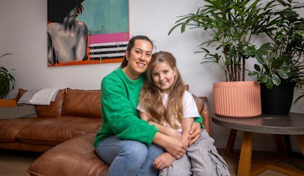 Brooke Adair, with daughter Olivia, says school families need more support for their neurodivergent children.