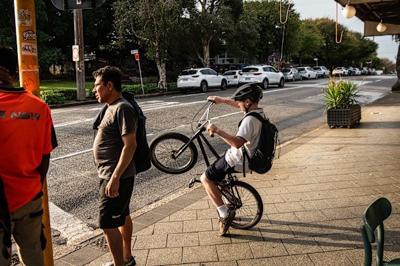 A bike rider on the intersection of Unwins Bridge Road and Railway Road.