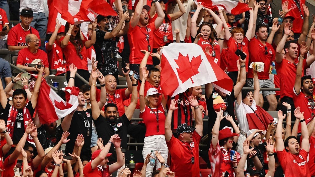 Canada fans cheering in the stands in Vancouver