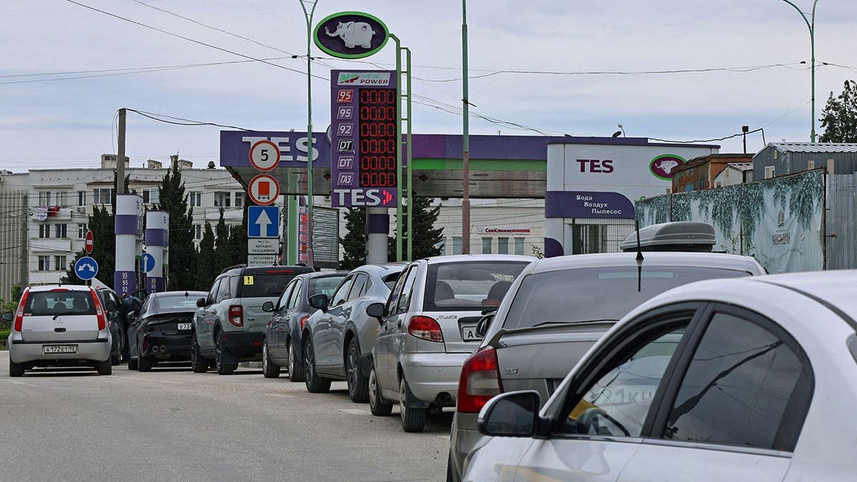 Cars queue for fuel at a gas station in Russia