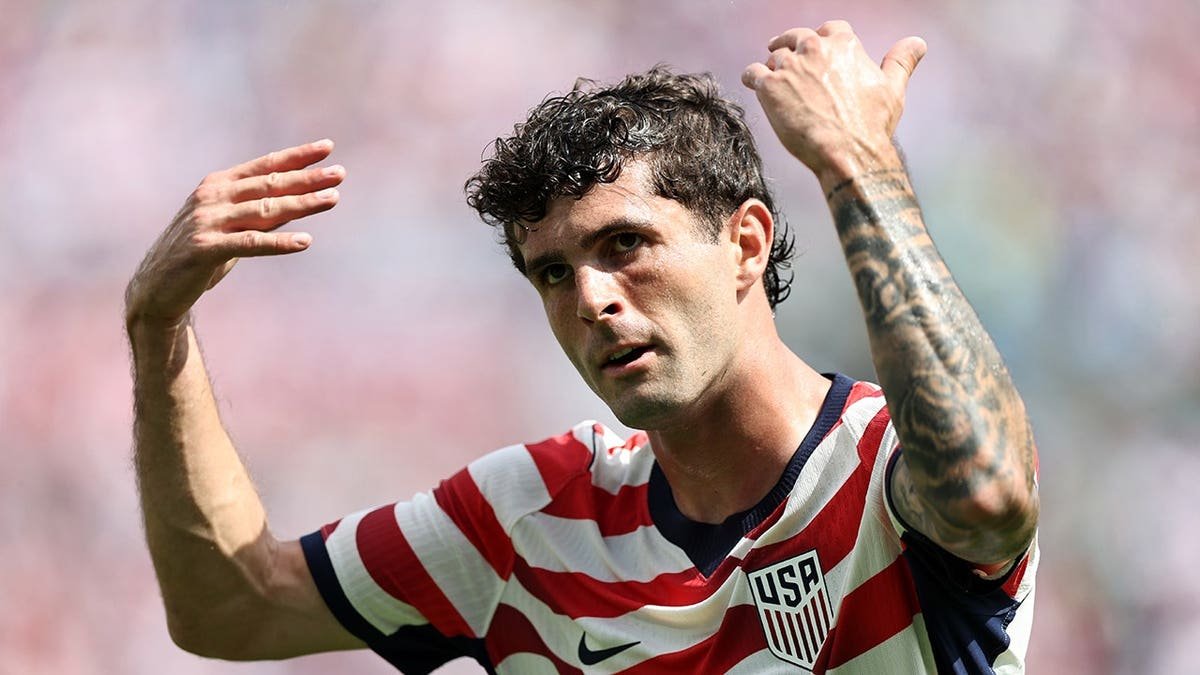 Christian Pulisic reacting during a soccer match at Bank of America Stadium