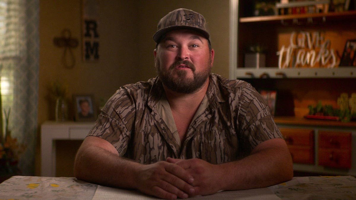 Codey Ott standing in a scene from Maternal Instinct.