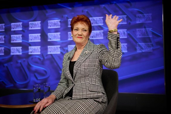 Senator Pauline Hanson waves to supporters who were seated to watch her National Press Club address.