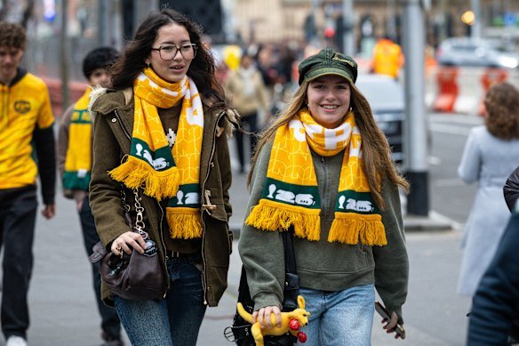 Socceroos fans head for Federation Square ahead of kick-off.