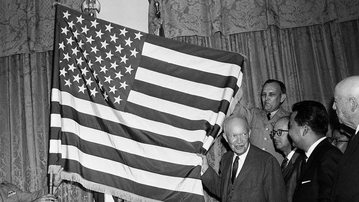 President Eisenhower with the American flag