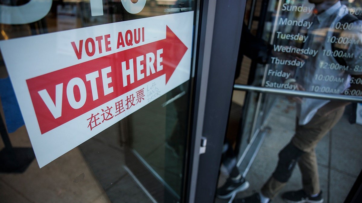 Voters entering the Cleveland Park Public Library polling place in Washington, DC