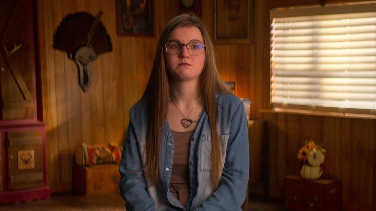 Emily Shirey standing in a scene from Maternal Instinct.