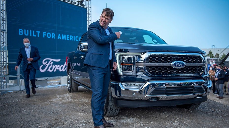 Jim Farley leaning on Ford truck