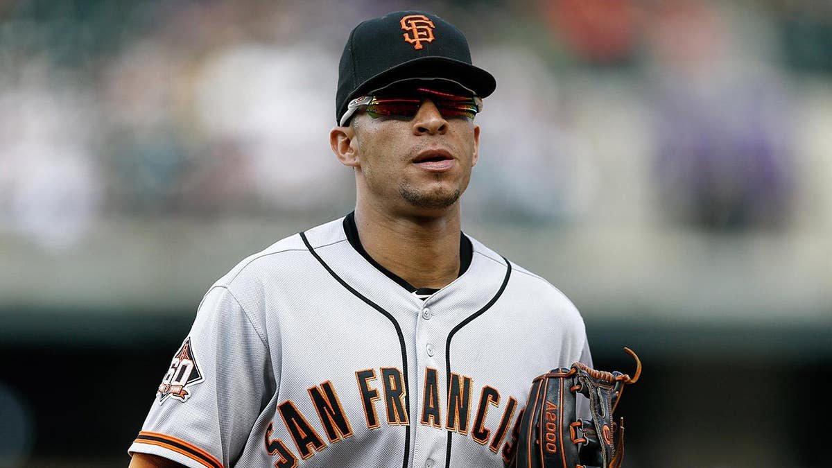 San Francisco Giants center fielder Gorkys Hernandez running to the dugout at Coors Field.