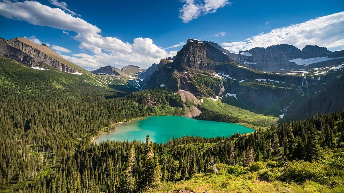 Grinnell Lake reflecting mountains in Montana