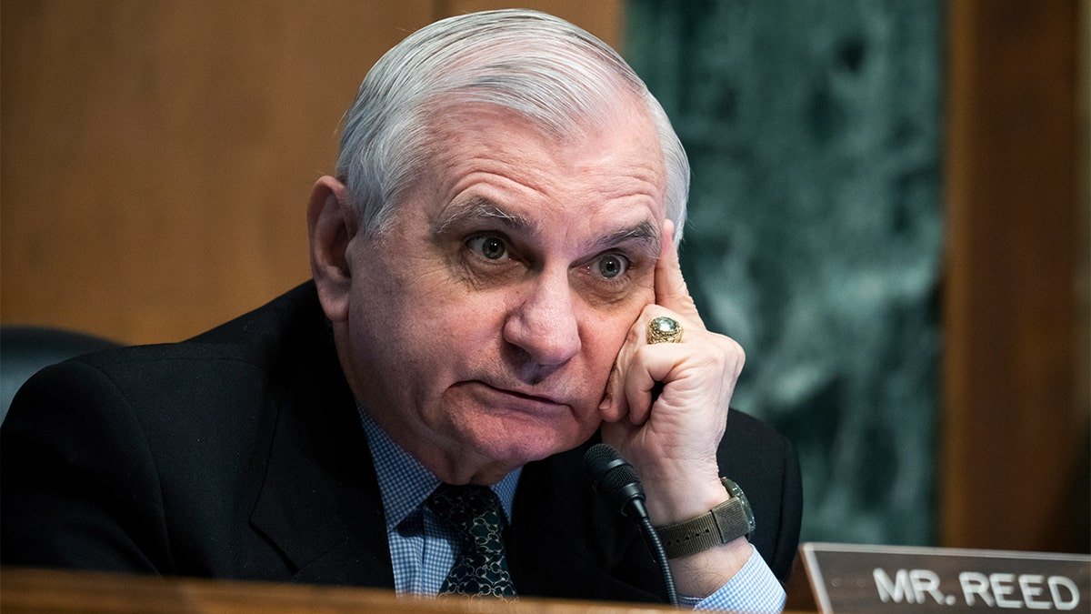 Sen. Jack Reed listening during Federal Reserve Chair Jerome Powell's testimony at a Senate committee hearing