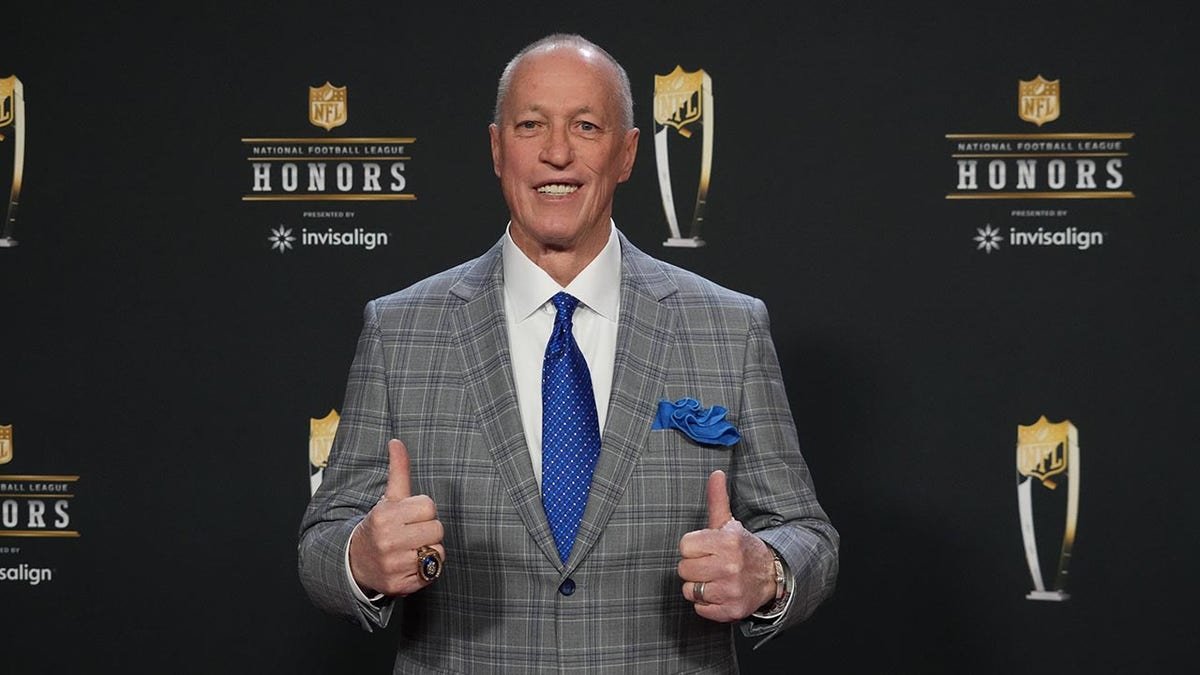 Former Buffalo Bills quarterback Jim Kelly posing on the red carpet at Symphony Hall.