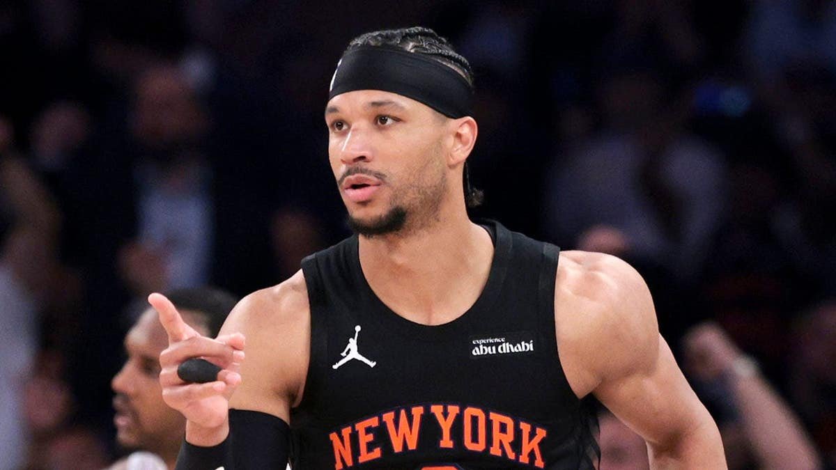 New York Knicks guard Josh Hart reacts after making a basket during a basketball game.