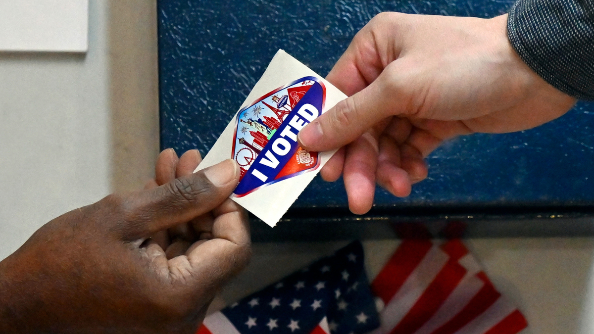 A voter receives a Las Vegas-themed 