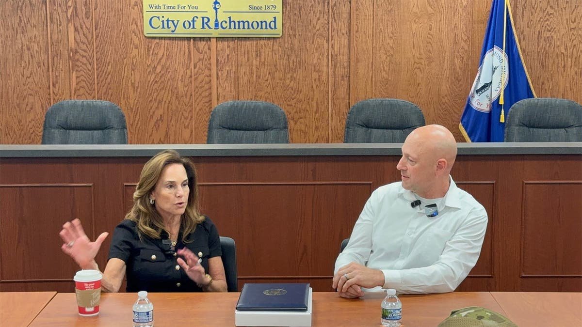 Lisa McClain, left, pictured alongside Ray Steir, right.