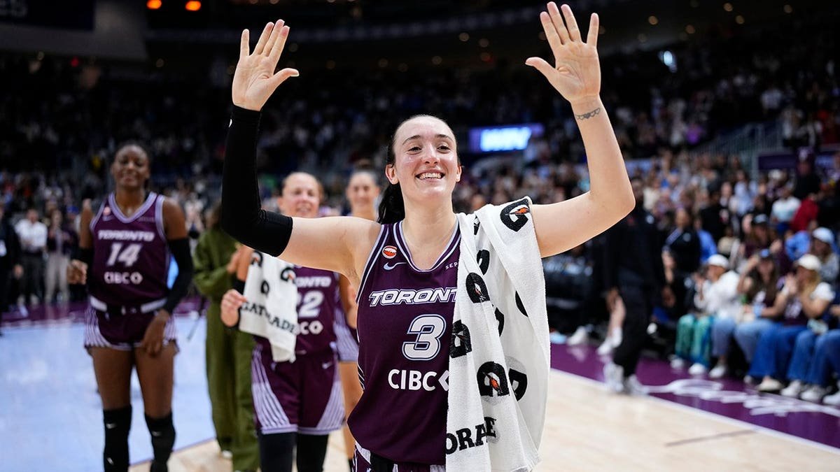 Marina Mabrey celebrating on the basketball court at Coca-Cola Coliseum in Toronto