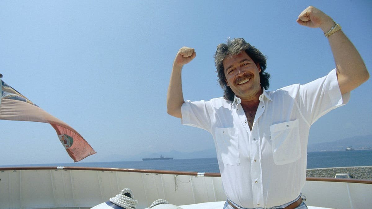 Mario Kasser standing on a boat in Cannes.