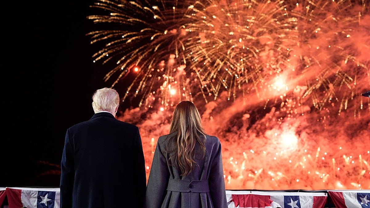 Then-President-elect Donald Trump and Melania Trump watching fireworks at Trump National Golf Club in Sterling, Virginia