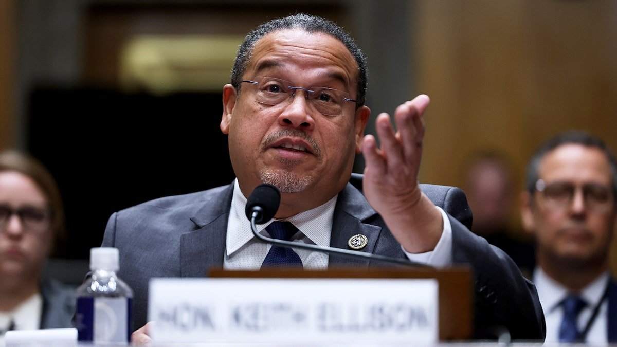 Minnesota Attorney General Keith Ellison speaking and raising hand during Senate Homeland Committee hearing