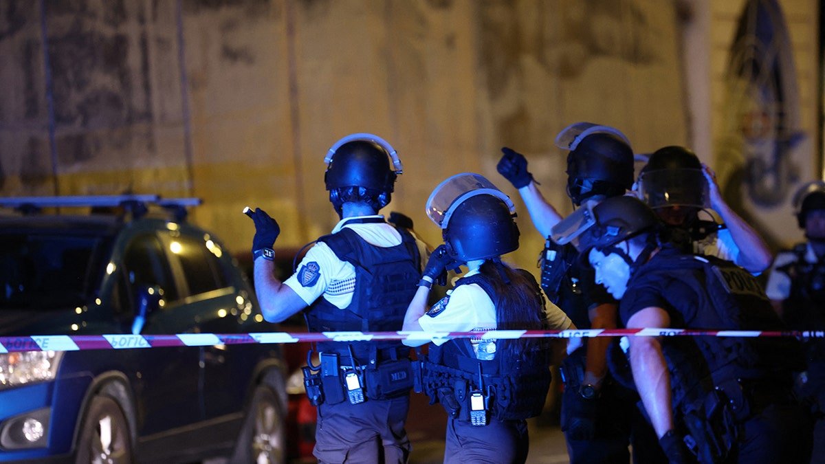 Monaco police officers patrol near the site of an explosion in a residential building in Monaco