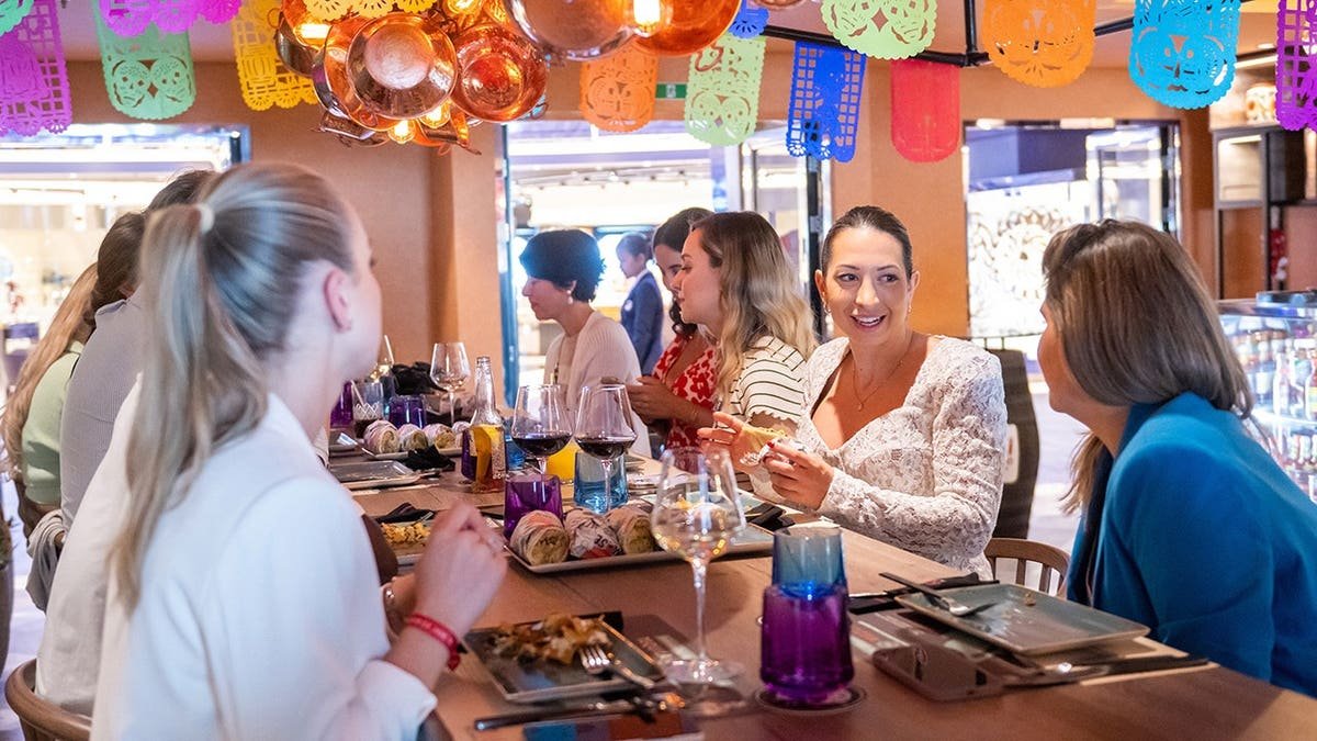 Guests enjoying food and drink at HOLA! Tapas Bar on board MSC Euribia in Copenhagen