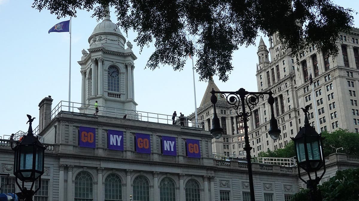 Banners hanging above City Hall in New York for Knicks NBA championship parade
