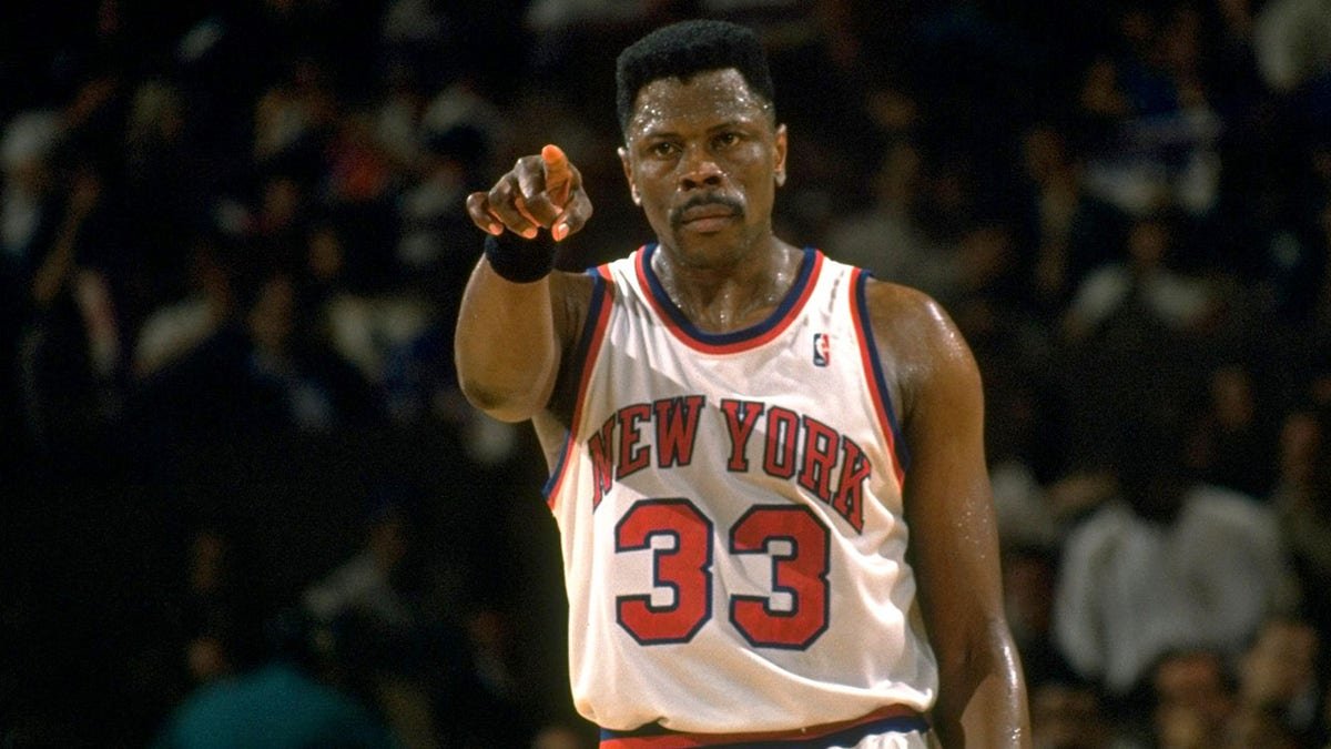 Patrick Ewing pointing during a basketball game at Madison Square Garden.