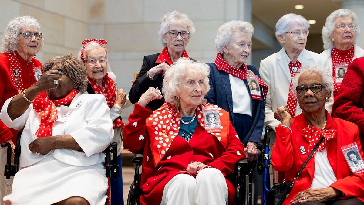 "Rosies" pose in front of the Statue of Freedom in Emancipation Hall at the U.S. Capitol before a Congressional Gold Medal ceremony on April 10, 2024, in Washington, D.C. Over two dozen women traveled from across the country to receive the medal for their World War II wartime efforts in factories and shipyards.