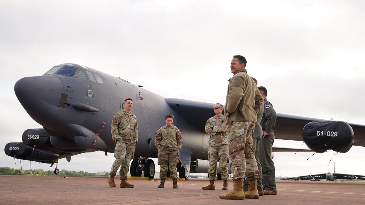 American aircrews inspecting a B-52 Stratofortress bomber on the pan at RAF Fairford