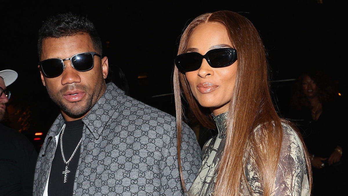 Russell Wilson and Ciara standing together at a birthday celebration in New York City