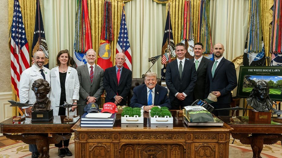President Trump surrounded by the Scotts Miracle-Gro team in the Oval Office.
