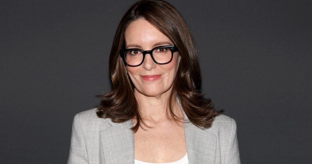 Tina Fey Made the ‘It’ Girl Red Sweater Trend Work for Summer, and Now We Want One Too Tina Fey Made the ‘It’ Girl Red Sweater Trend Work for Summer, and Now We Want One Too