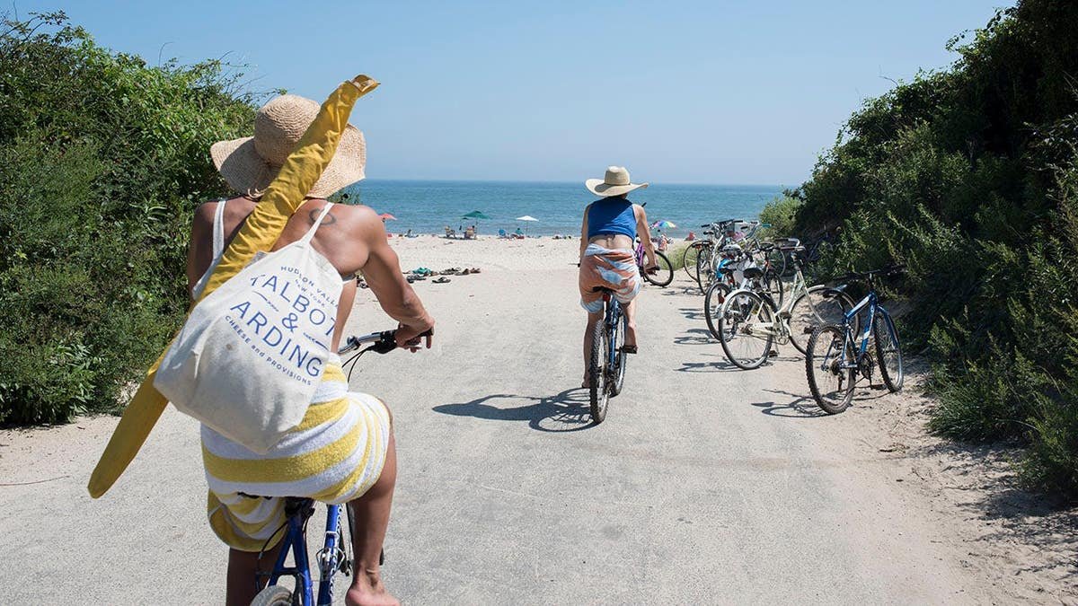 Bicycles and sandals resting on sand at Gibson Beach in Bridgehampton