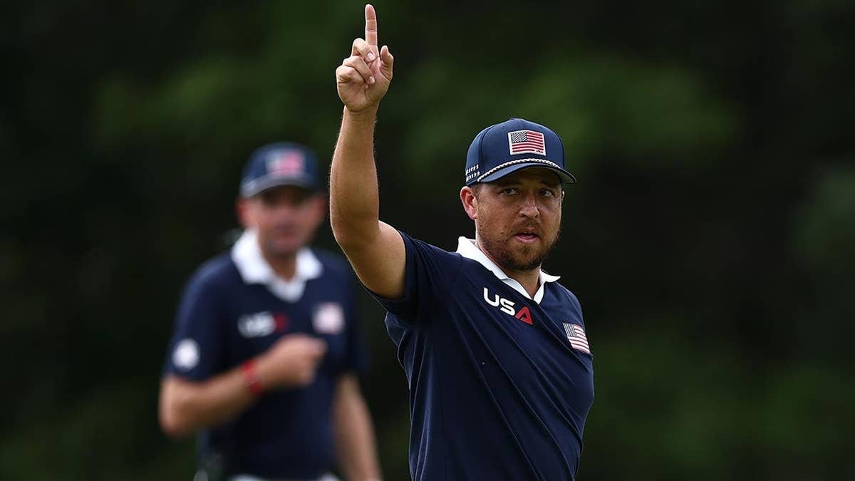 Xander Schauffele reacting on the fourth green during Ryder Cup four-balls matches