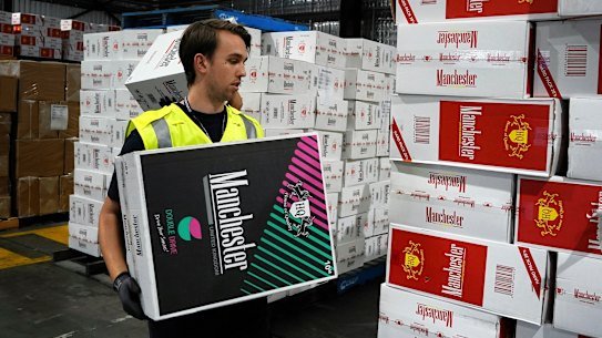An Australian Border Force officer checks a stash of illegal cigarette imports.