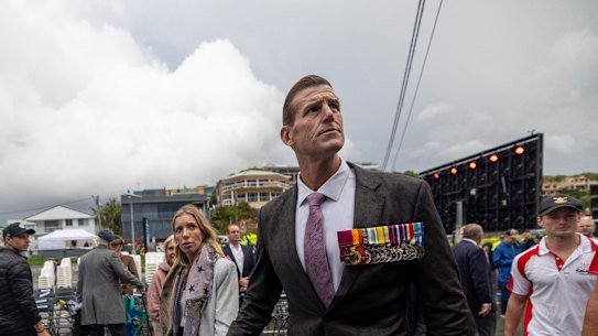 Ben Roberts-Smith and his partner Sarah Matulin attending a dawn service in Currumbin, Queensland, last month. 