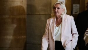 Paris court clears way for Le Pen presidential bid but with ankle tag