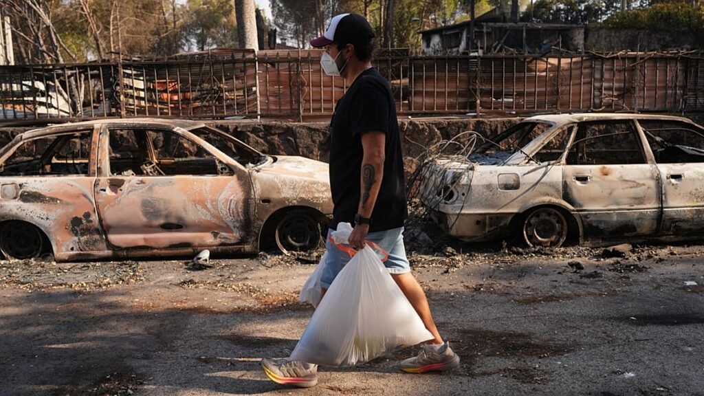 Fire evacuees return in Spain while France wary of worsening weather Fire evacuees return in Spain while France wary of worsening weather