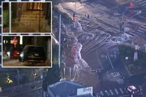 Huge torrent of water races down West Hollywood’s Sunset Strip destroying homes