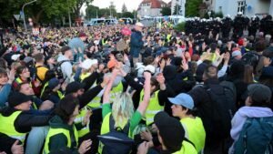 Tens of thousands of far-left protesters clash with police in anti-conservative party riots