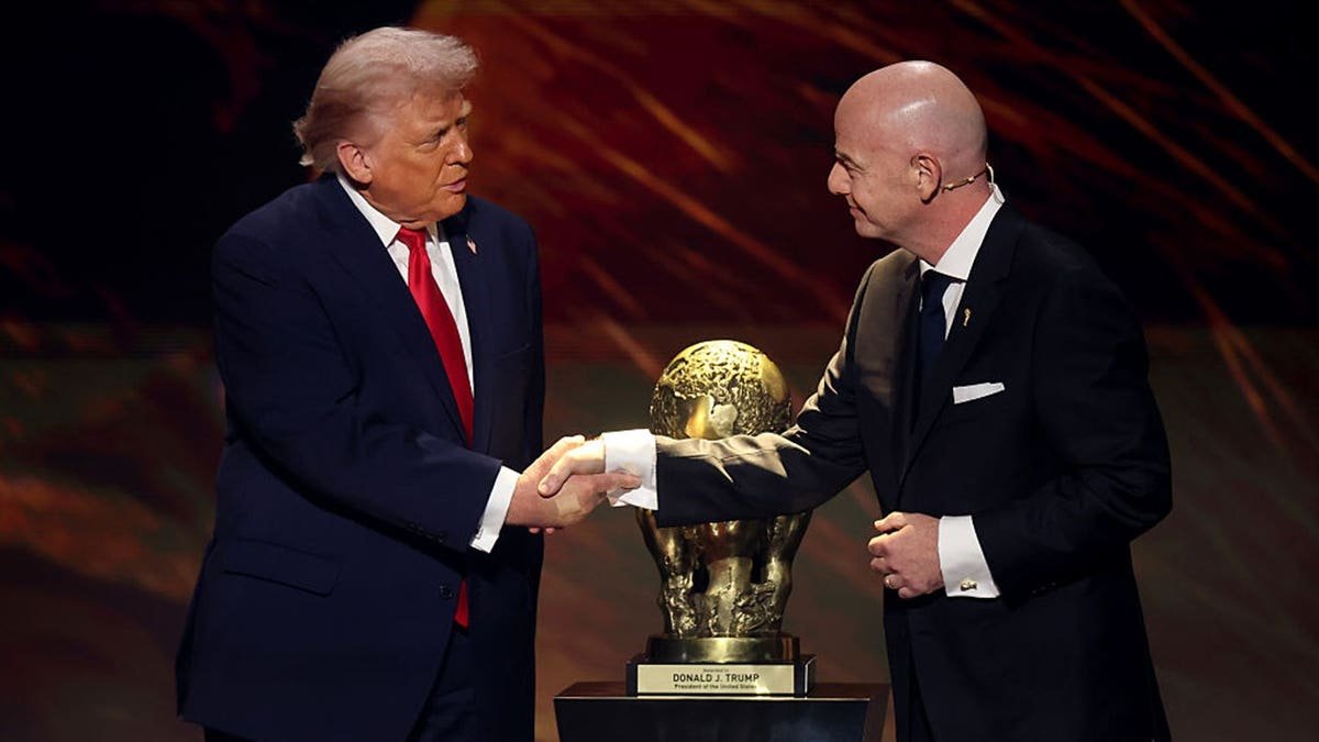 president donald trump shakes hands with fifa president gianni infantino
