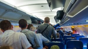 Major airline roasts passengers who jump up right after landing, igniting fierce backlash