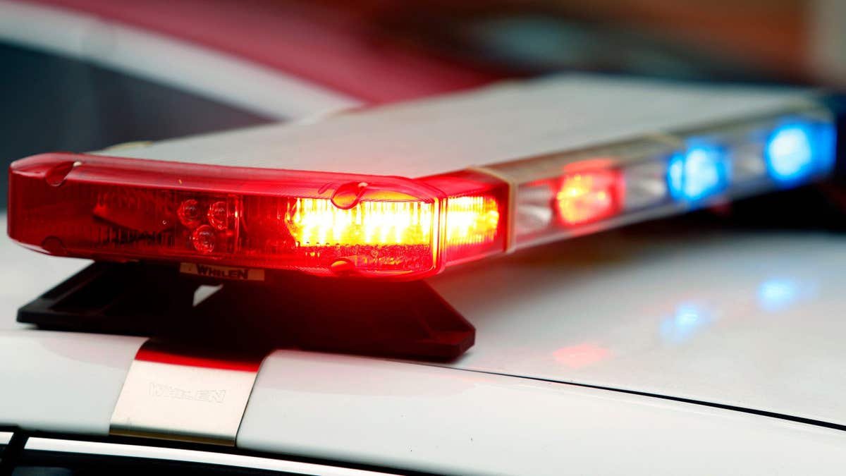 Close-up file photo of red and blue police lights on top of a law enforcement vehicle, representing a residential burglary investigation in Nevada