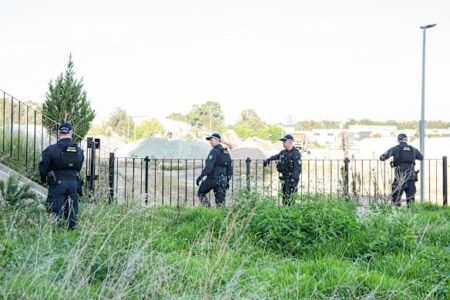 Two charged with murder as hunt continues for accomplices Two charged with murder as hunt continues for accomplices