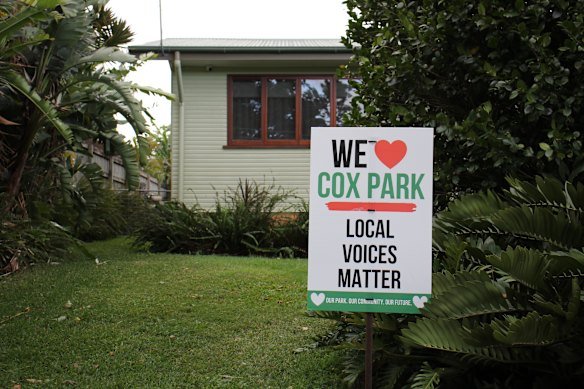 Many homes surrounding Cox Park had erected signs calling for further consultation on Sunday. 